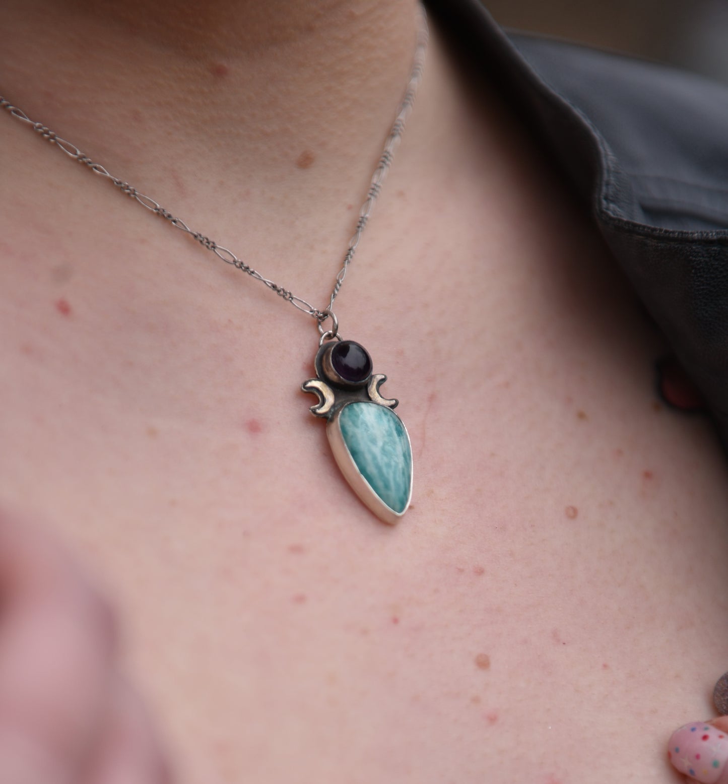 Amethyst and amazonite with two moons sterling silver pendant closeup